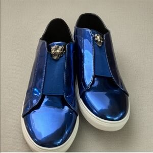 Shiny Blue Slip-On Sneakers with Lion Accent